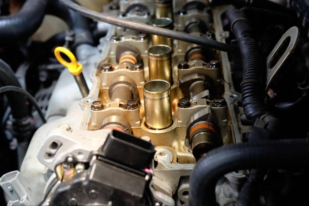A repaired engine valve component looking brand new.